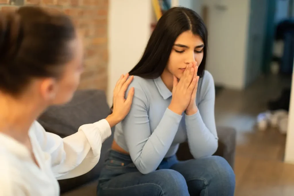 teen in blue shirt getting treatment from therapist for nicotine addiction in california.